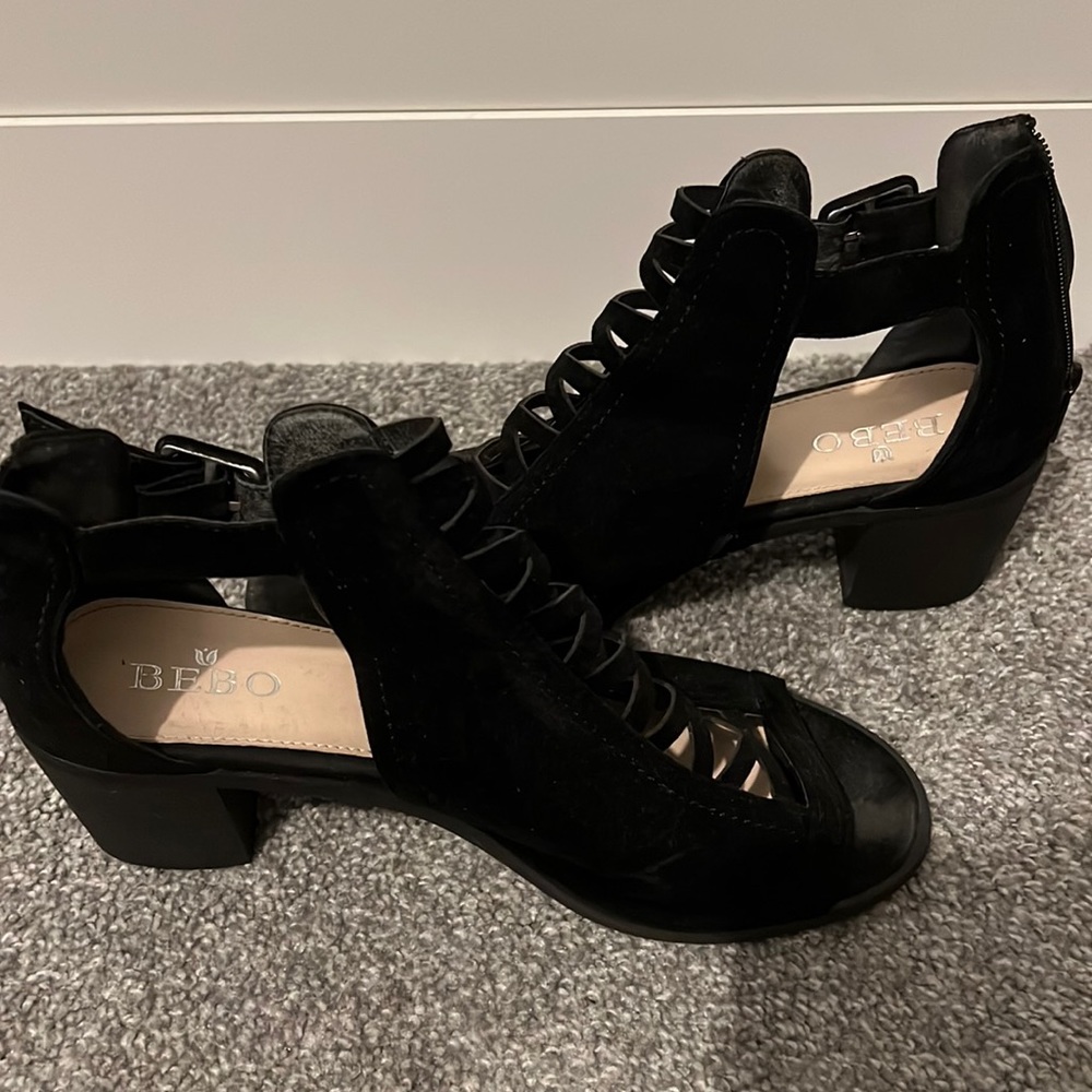 Peep toe black ankle booties. Lace effect in front